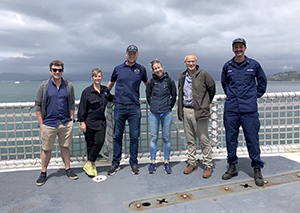 Image showing navigation response team members standing with memebers of the New Zealand Hydrographic Office.