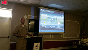 Lt. Cmdr. Wartick presents a slide on coastal intelligence at the Great Harbor Trawlers Association Conference.