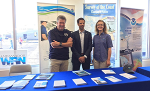 Tim Osborn (left), the navigation manager for the east Gulf Coast, Dr. Neil Jacobs (center), Assistant Secretary of Commerce for Environmental Observation and Prediction