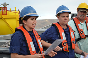 Ensign Levano, Lt. Clos, and  Kirk Perry on board NOAA Ship Rainier.