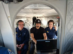 Rear Adm. Shep Smith, Jamie Kum, and Capt. Liz Kretovic in a NOAA Twin Otter