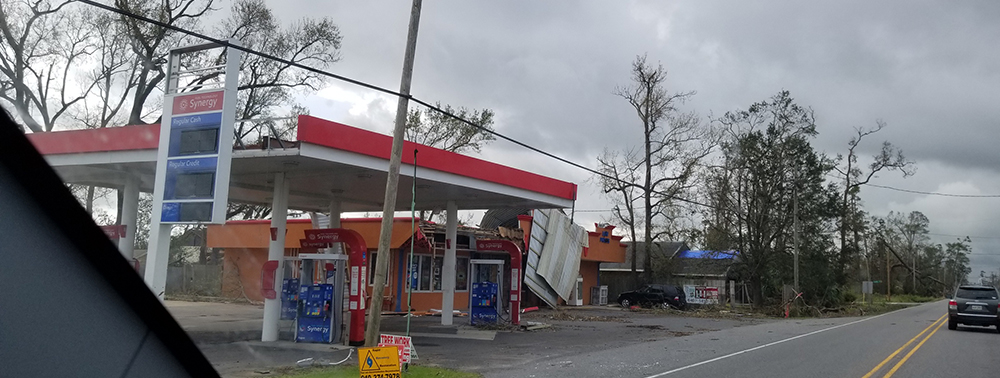 damaged gas station on the side of the road