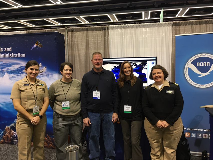 Members of Coast Survey pictured in front of booth at the Ocean Science conference.