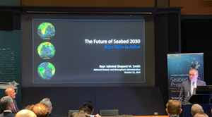 RDML Smith giving the keynote speach at the Seabed 2030 summit