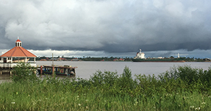 freighter navigating down the Suriname river from the port to the ocean
