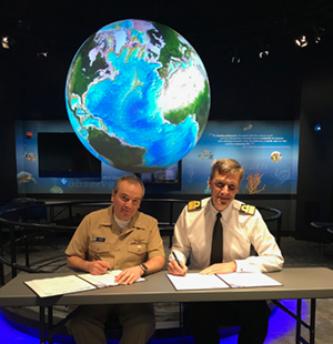 
	RDML Smith and RDML signing the agreements