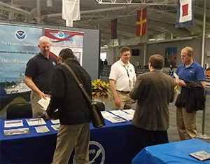 Darren Wright (CO-OPS) and Steve Soherr (OCS) staff the NOAA booth at the U.S. Coast Guard Industry Day