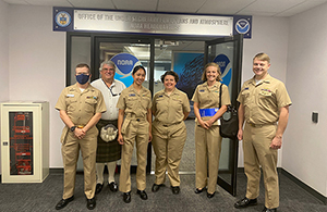 An image showing a group of people consisting of NOAA Corps officers and one civilian employee