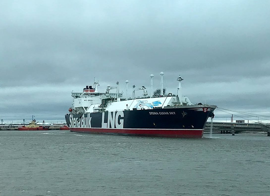 An image showing a liquid natural gas vessel loading cargo at Sabine Pass, Louisiana.