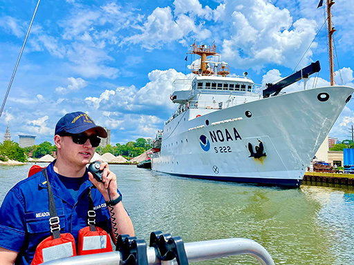 An image of Mark Meadows with a NOAA survey vessel in the background.