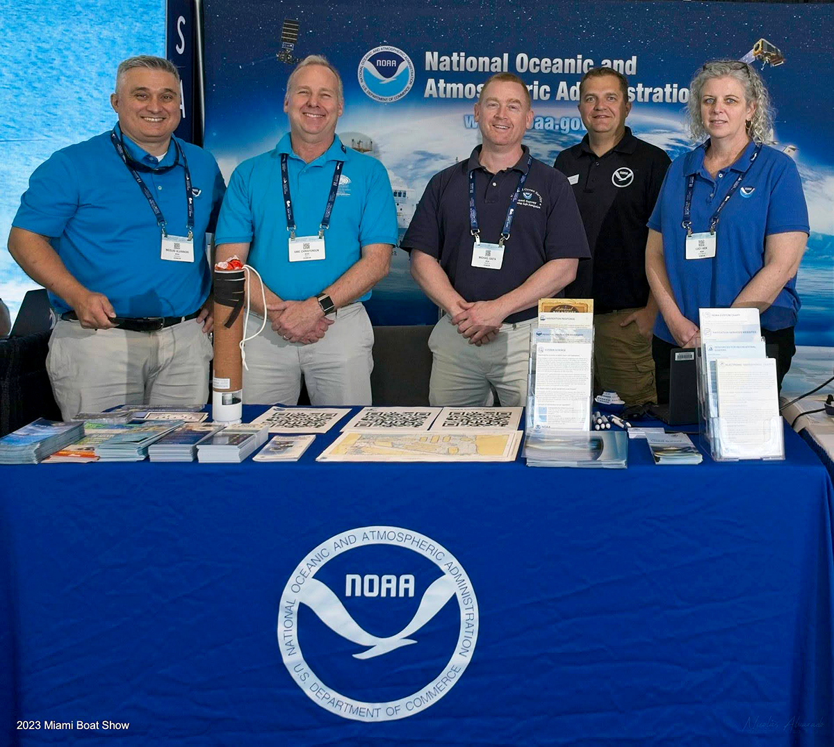 Coast Survey emplyees and the booth at the 2023 Miami Boast Show. From left to right are: Nicolás Alvarado, Eric Christensen (NWS), Michael Gaeta, Kyle Ward, and Lucy Hick.