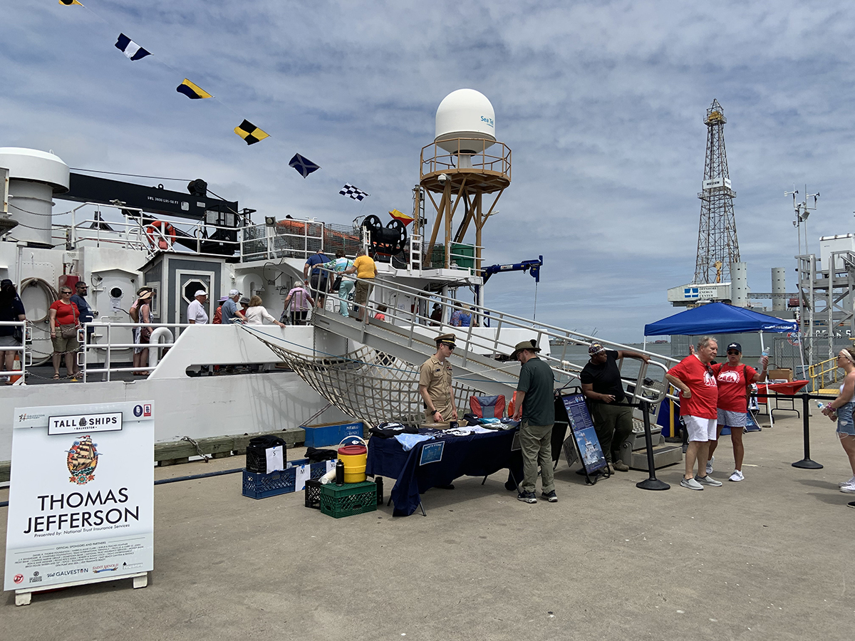 An image of NOAA Ship Thomas Jefferson with information booth and gangway at the 2023 Tall Ships Galveston event.