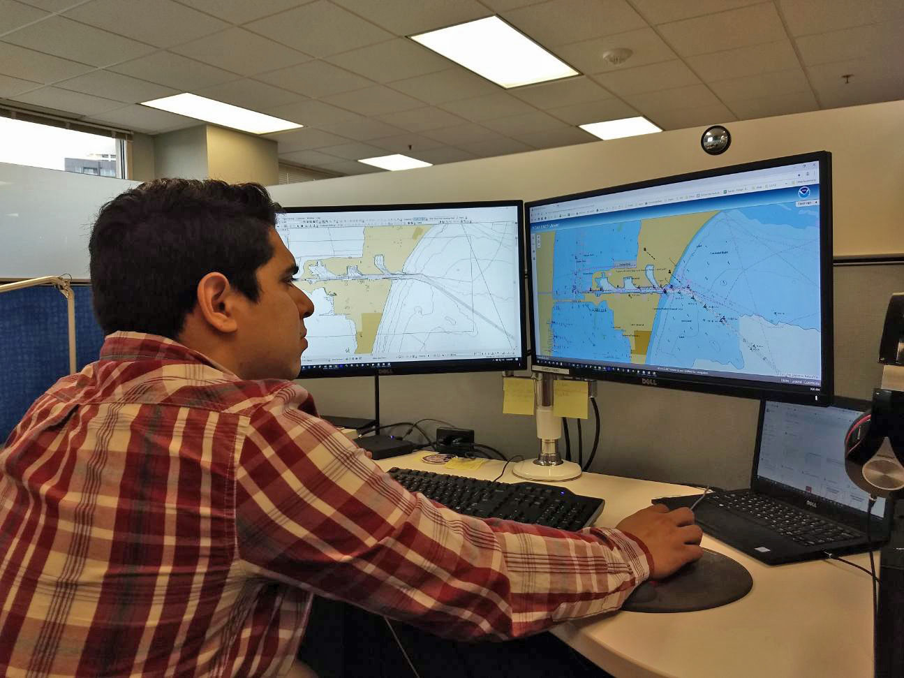 Cartographer Julio Castillo at a workstation.