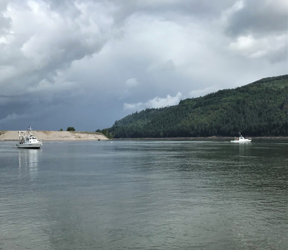 Two NWFSC boats conducting a biological trawl on the Columbia River.