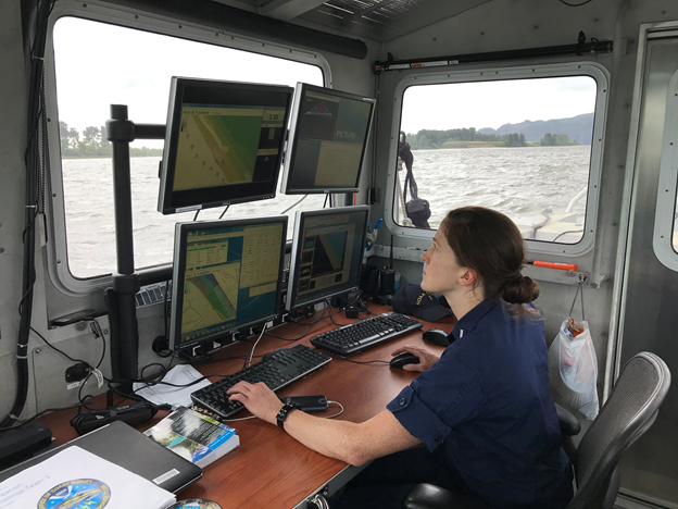 Lt. j.g. Shelley Devereaux monitors survey collection near Price Island on the Columbia River.