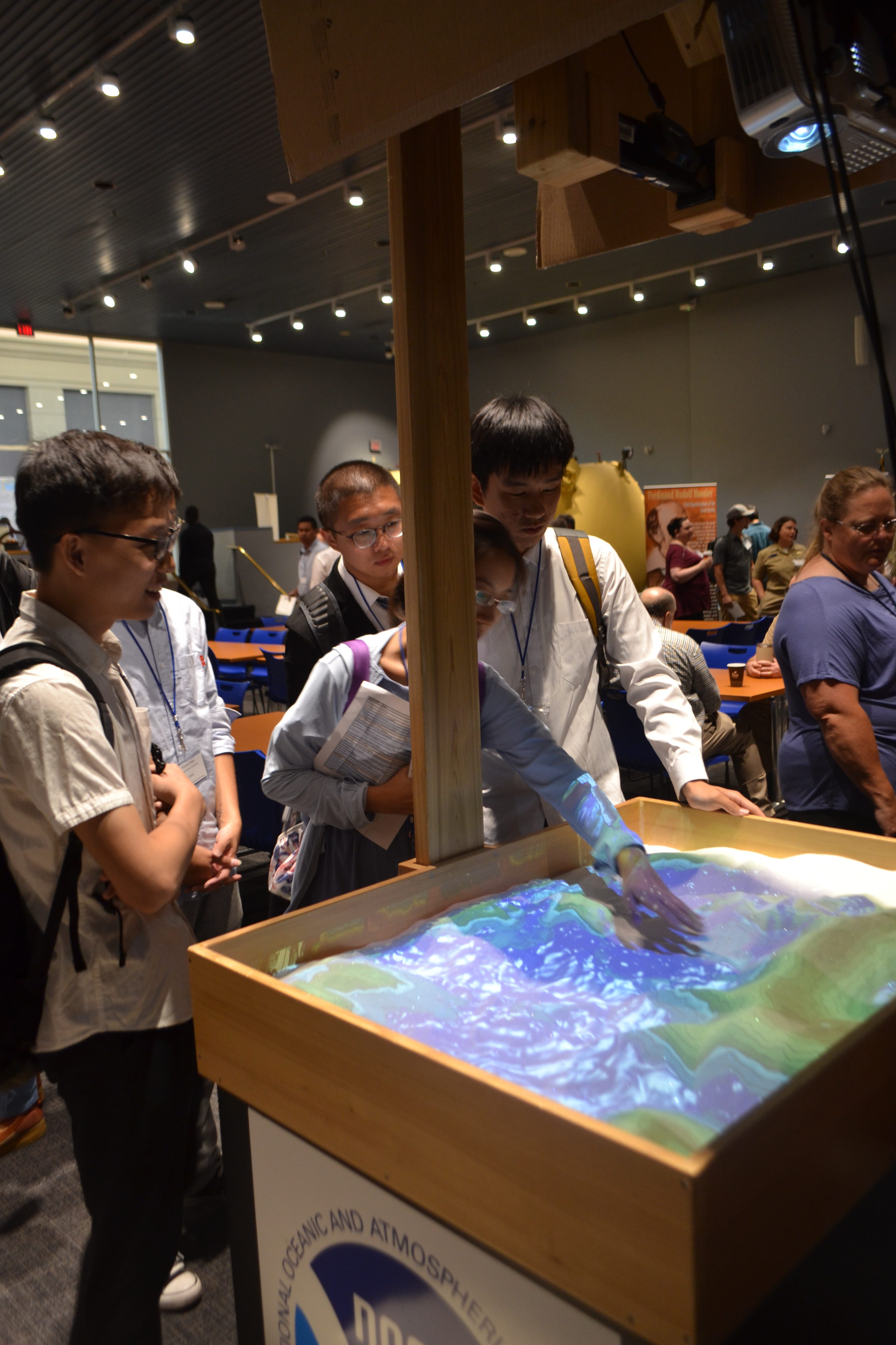 Students with the 3D interactive sandbox.