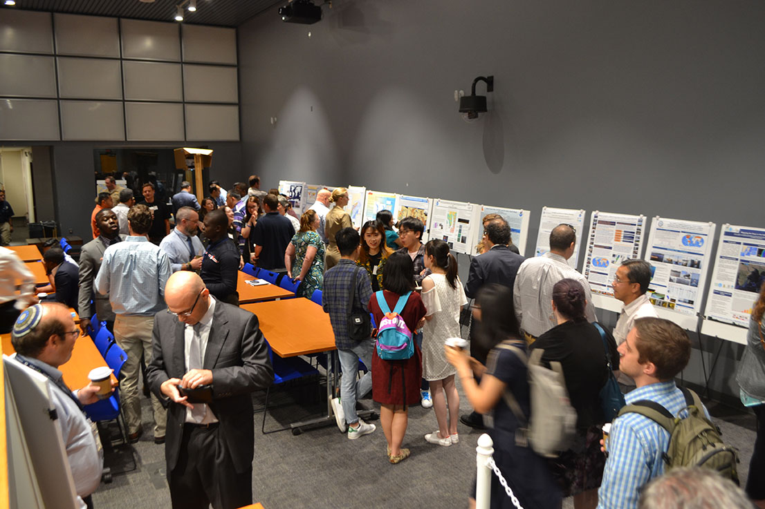 Open house attendees at the poster session.