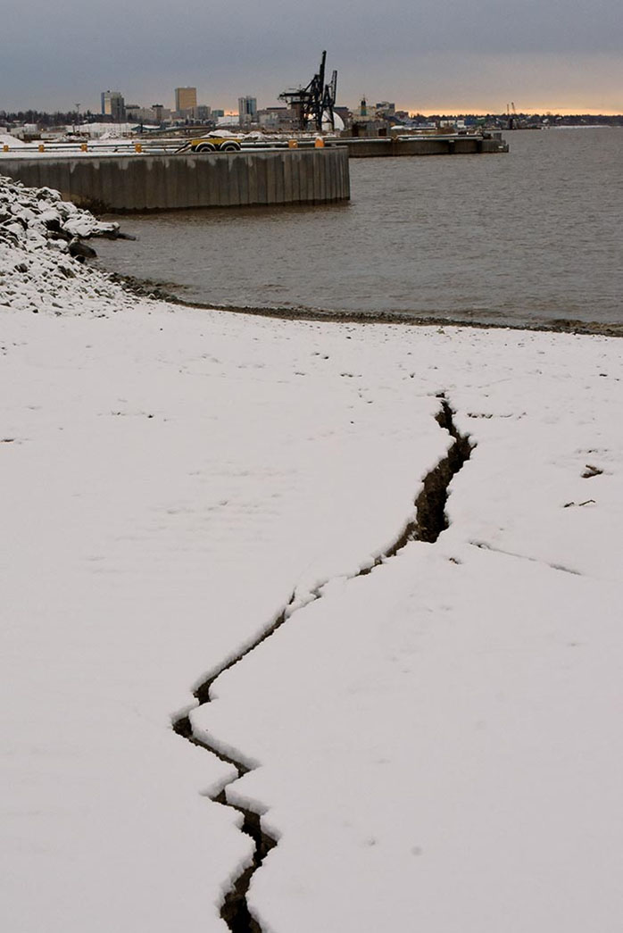 Cracks in the ground at the dry barge berth (looking southwest) following the earthquake on November 30 at the Port of Alaska.