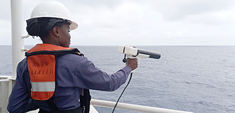 An image showing Sub-Lieutenant Mercy Modupe Ogungbamila using an Expendable Bathythermograph.