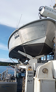 An image showing one of NOAA Ship Rainiers hydrographic survey launches resting in the ship's davit.