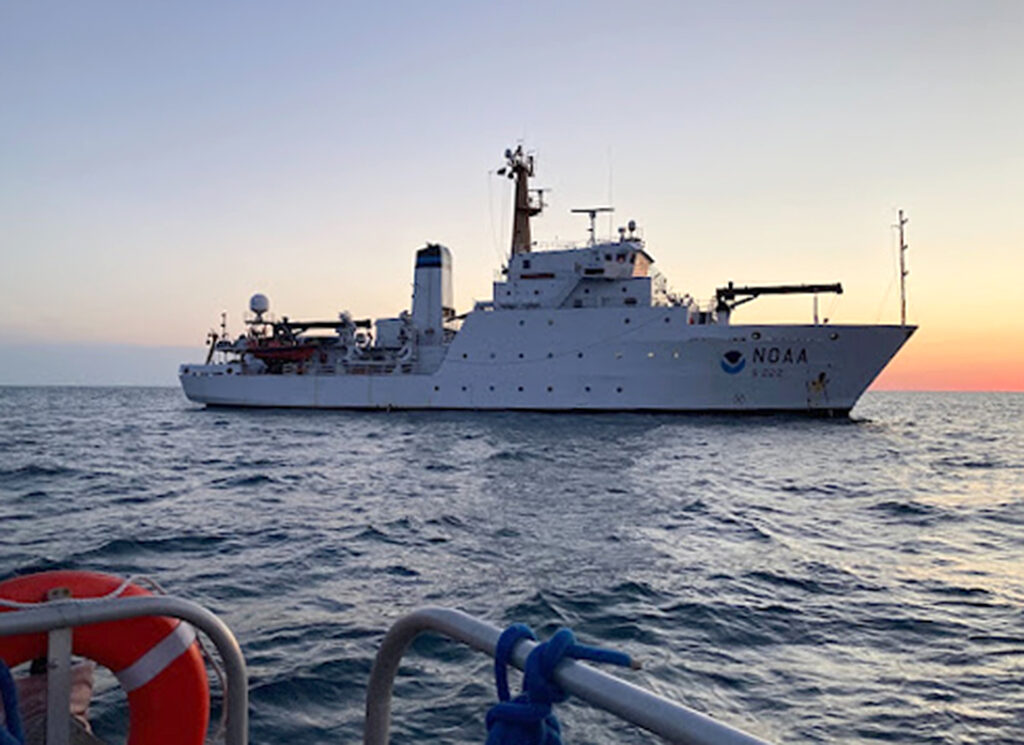 NOAA ship Thomas Jefferson from survey launch 2904 at sunrise. 