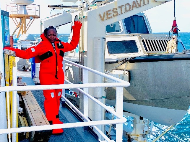 An image of Victoria Obura wearing an immersion suit during the abandoned ship safety drill on NOAA Ship Thomas Jefferson.
