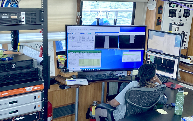 An image of Daina Mathai running data acquisition for Bay Hydro II.