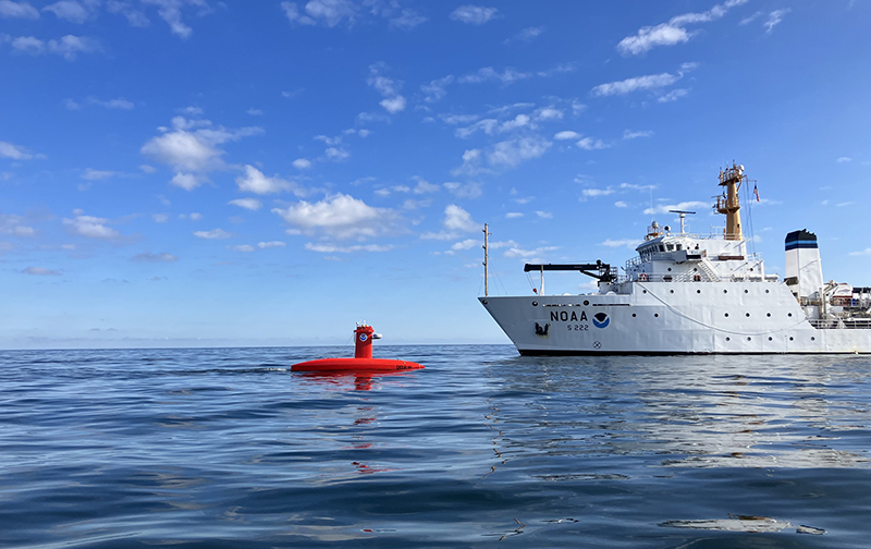 An image of NOAA Ship Fairweather working with an uncrewed surface vehicle.